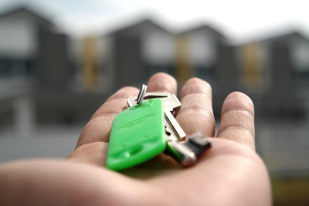A house key, representing selling a home and letting go