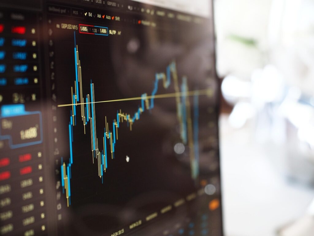 A blurred stock market ticker board, representing market reaction to economic data