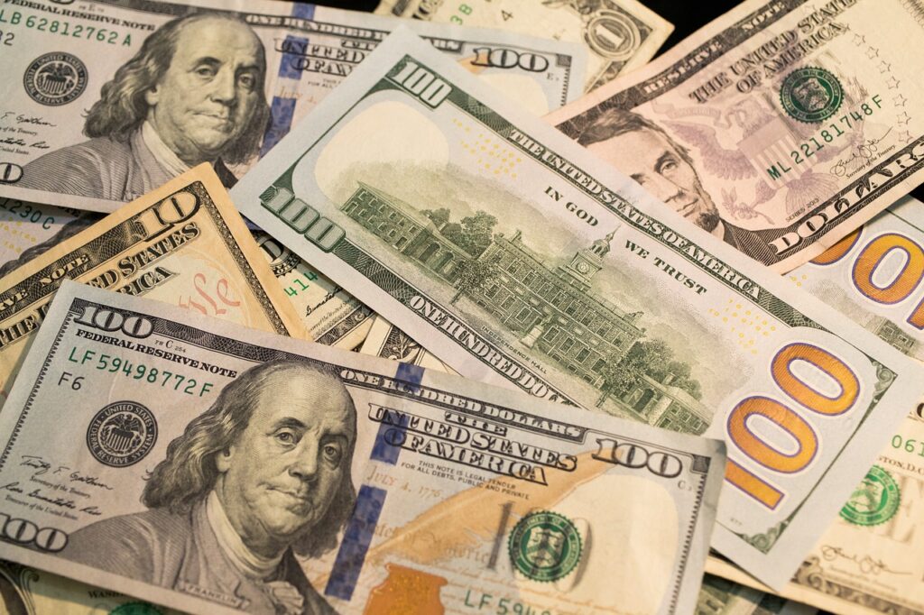 A US one-hundred-dollar bill featuring Benjamin Franklin, symbolizing retirement savings and the 401(k) system