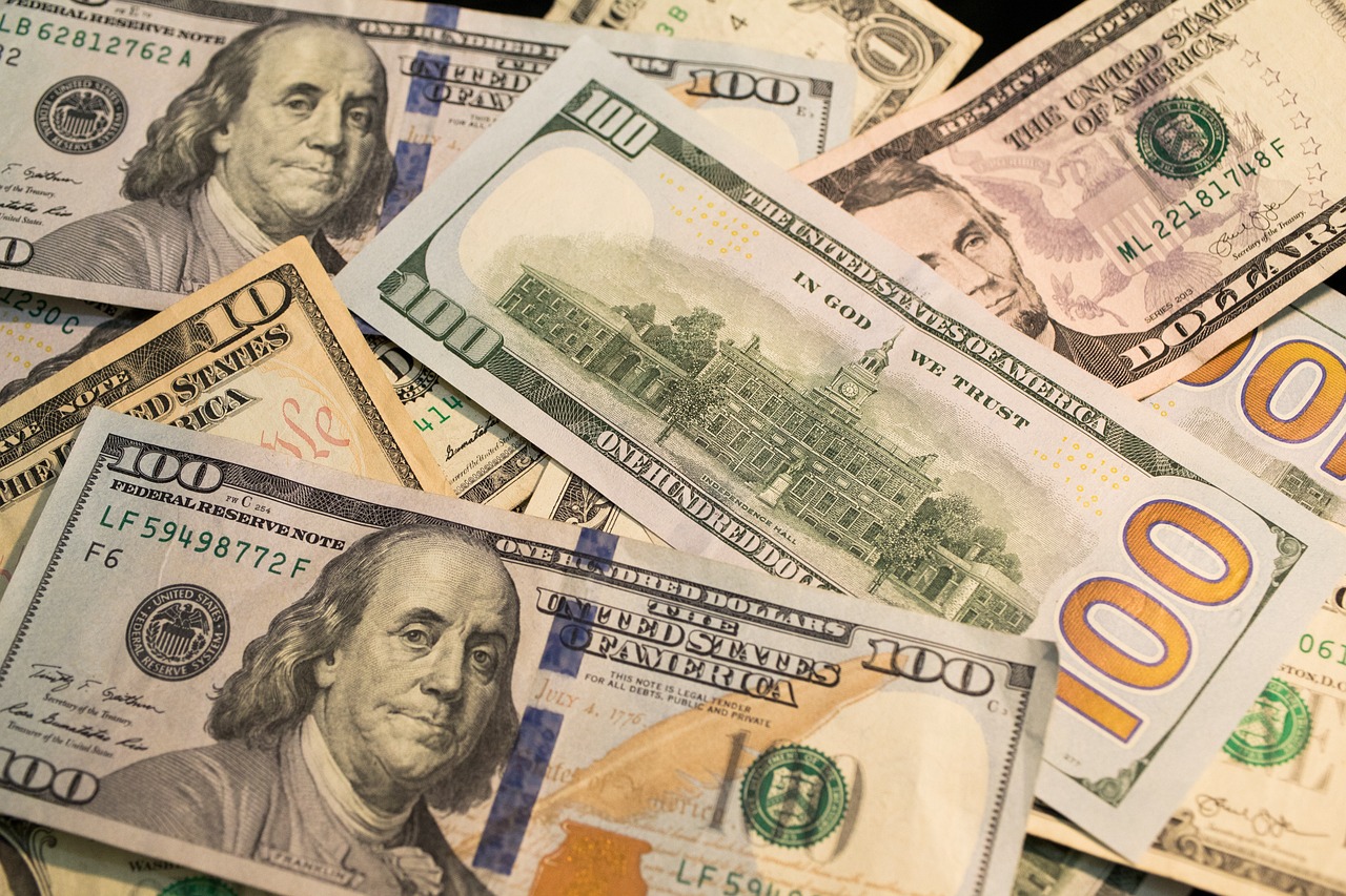 A US one-hundred-dollar bill featuring Benjamin Franklin, symbolizing retirement savings and the 401(k) system