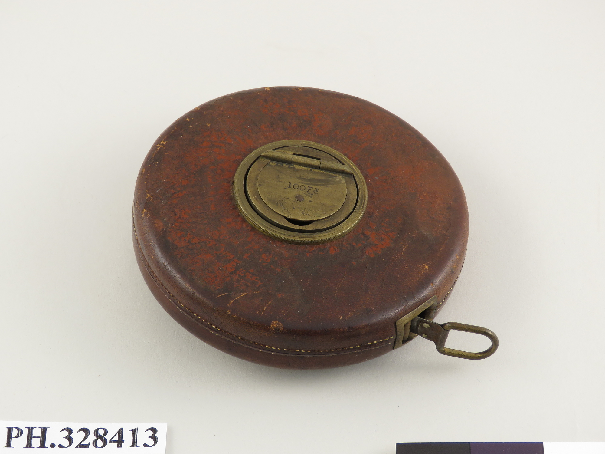 A vintage Chesterman brand tape measure, illustrating how a fixed increment can still stretch across long distances.