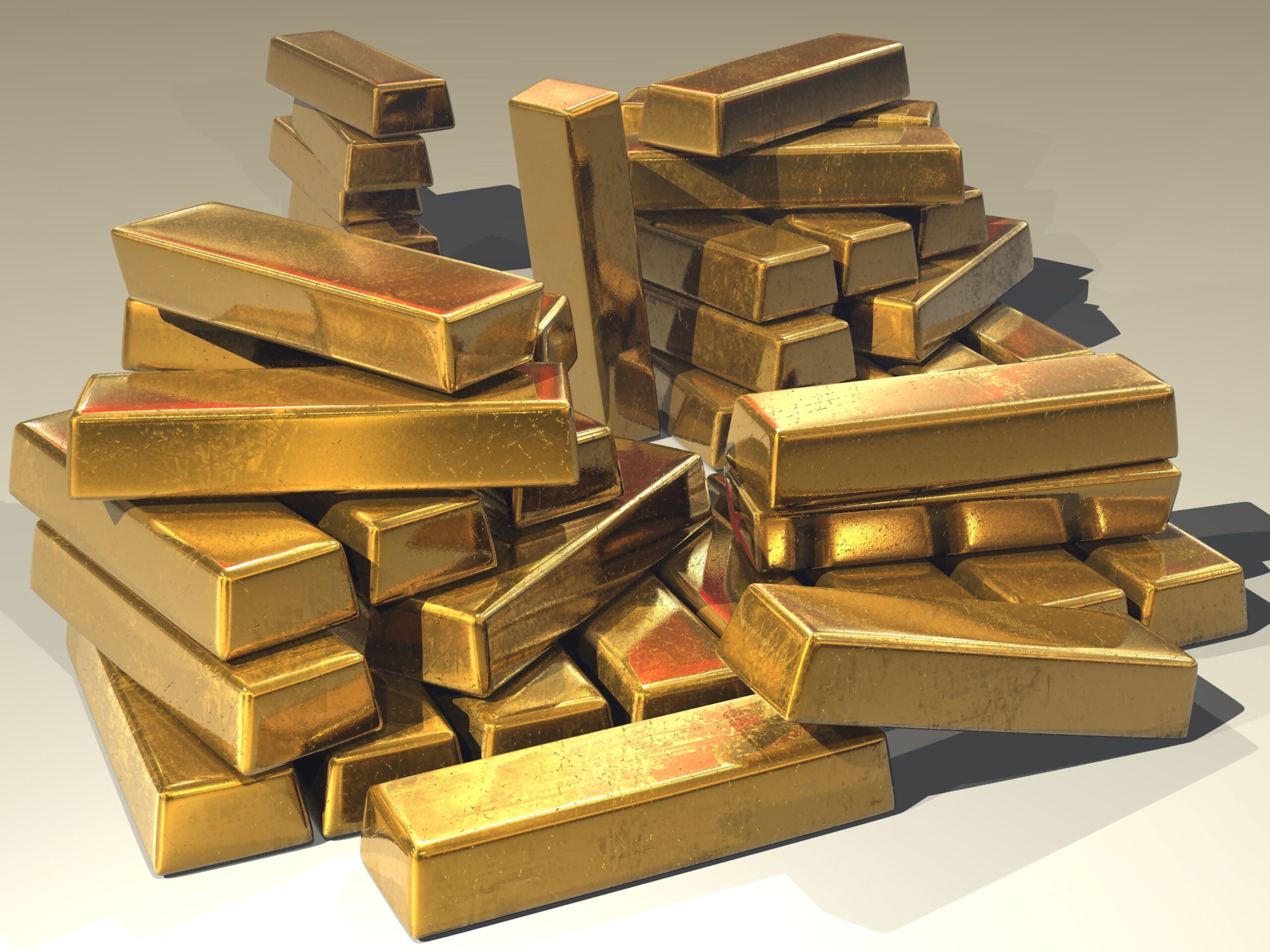 Stacked gold bullion bars, a zero-yield asset with no dividend or interest income